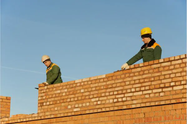 Brick laying masonry worker