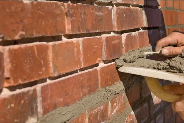 a man repairing old bricks