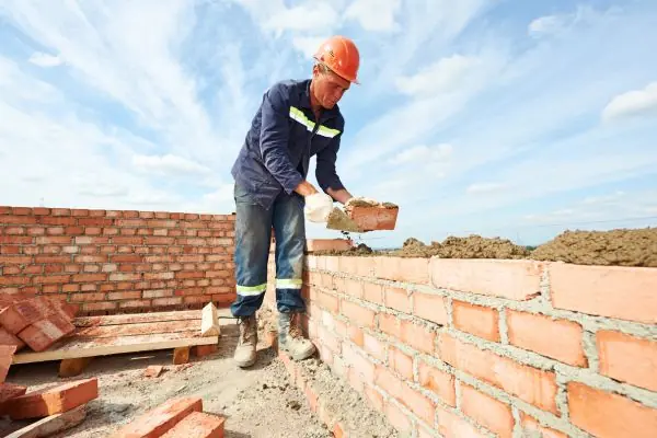 masonry contractors installing bricks