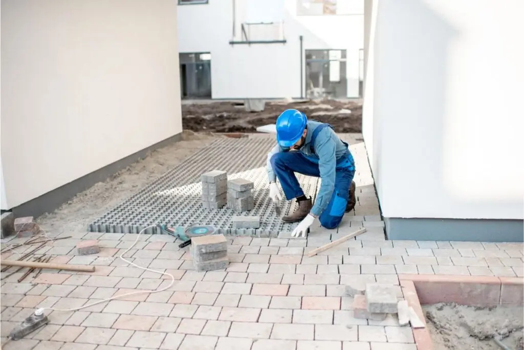 builder mounting paving tiles