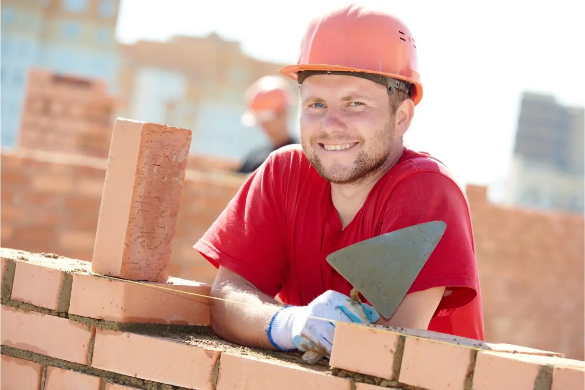 mason worker smiling at work site