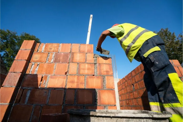 masonry contractors building new home using bricks