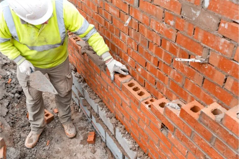 construction worker working on residential bricks laying