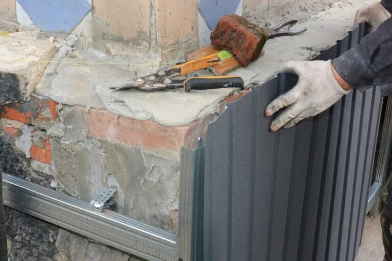 masonry contractor working on a concrete foundation repair in Hull MA