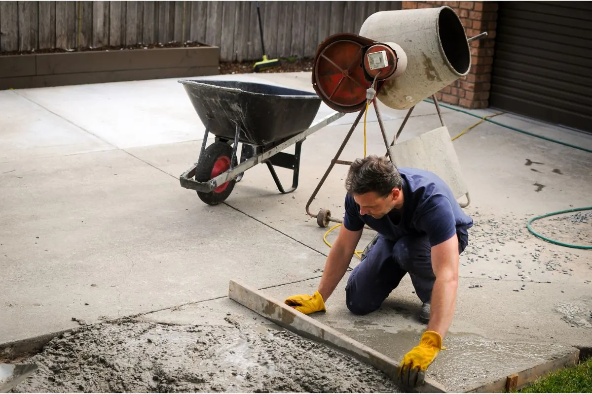 masonry contractor installing concrete driveway